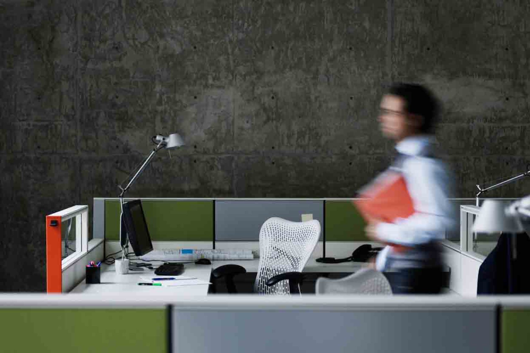 Blurry person walking on the office